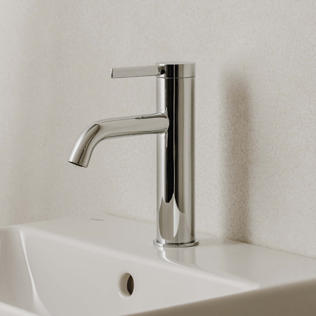 Lifestyle image of the Roca Ona Chrome Basin Mixer Tap with Click-Clack Waste installed on a basin